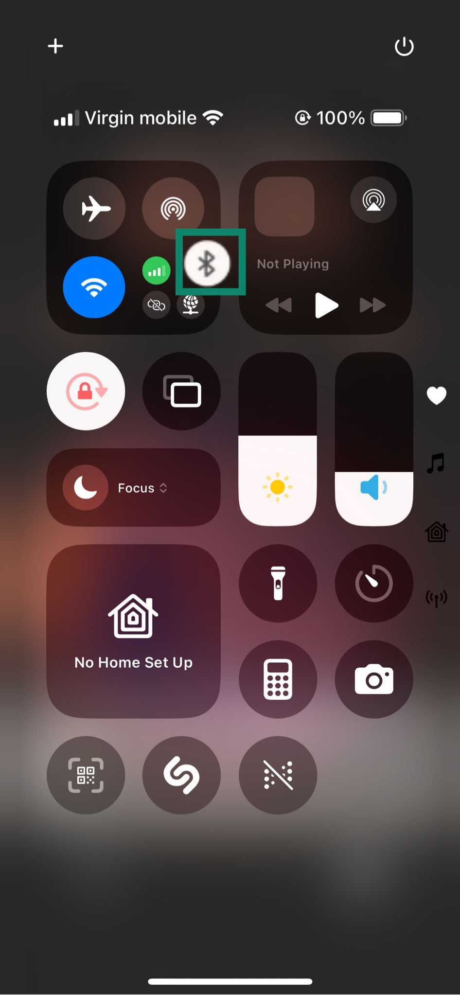 Turning off Bluetooth via Control Center on an iPhone.